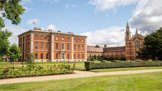 The Mansion and grounds of Radley College on a bright summer day