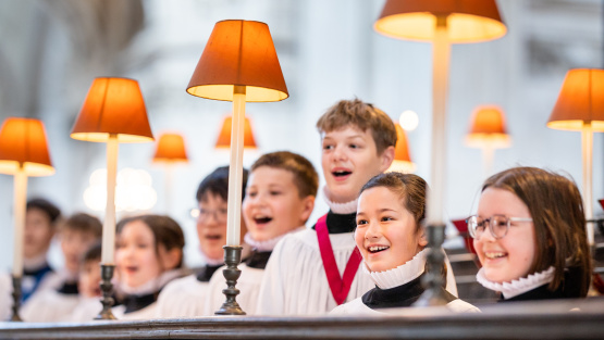 Choristers of St Paul's Cathedral singing in the cathedral stalls